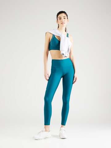 Skinny Pantaloni sport de la UNDER ARMOUR pe verde