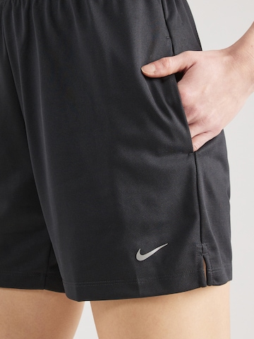 NIKE Regular Workout Pants 'ATTACK' in Black