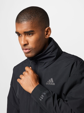 ADIDAS SPORTSWEAR Куртка в спортивном стиле 'Traveer' в Черный