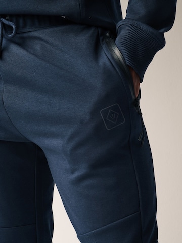 Next Tapered Weatherproof pants in Blue
