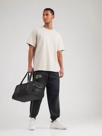 Nike Sportswear Štandardný strih Nohavice 'AIR' - Čierna