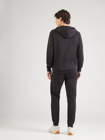 PUMA Тренировочный костюм 'ESS' в Черный