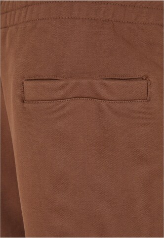 Tapered Pantaloni di Urban Classics in marrone