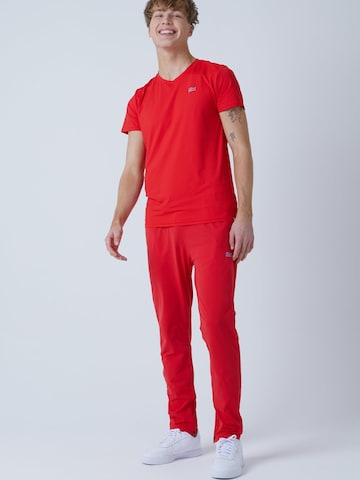 SPORTKIND - Slimfit Pantalón deportivo 'Slim Training Pants' en rojo: frente