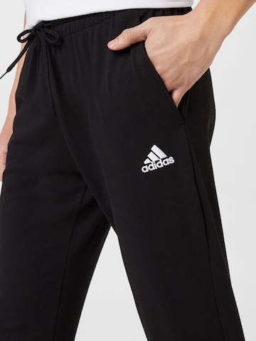 ADIDAS SPORTSWEAR Zúžený strih Športové nohavice 'Essentials Tapered Cuff' - Čierna
