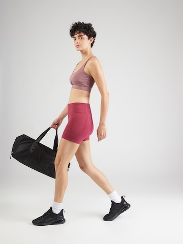 UNDER ARMOUR - Skinny Pantalón deportivo 'Motion' en rojo