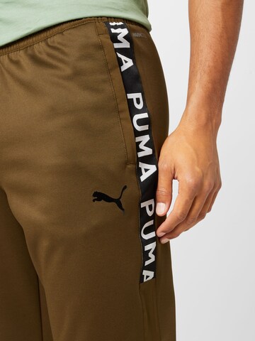 PUMA Tapered Sporthose in Grün