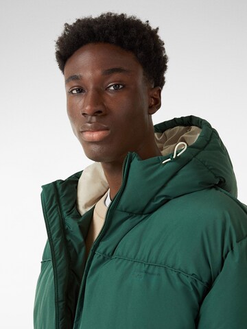 Bershka Zimska jakna | zelena barva