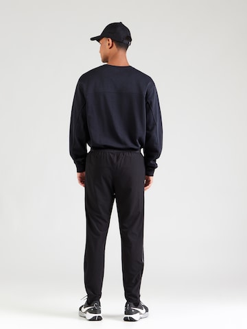 UNDER ARMOUR - regular Pantalón deportivo 'Velociti' en negro