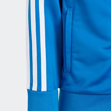 ADIDAS ORIGINALS Träningsoverall 'Adicolor Sst' i blå