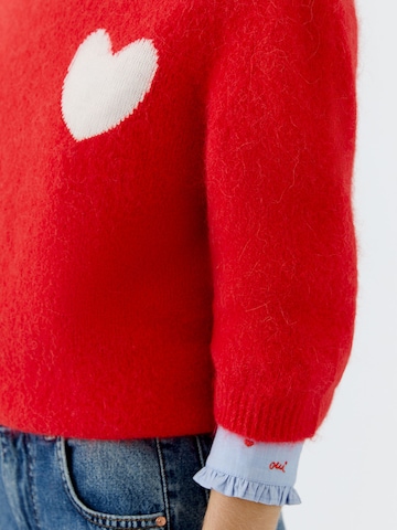 OUI Neulepaita värissä punainen