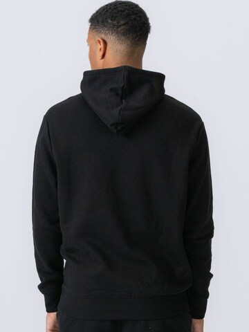 Pull-over ' Essential Hoodie ' TEESHOPPEN en noir