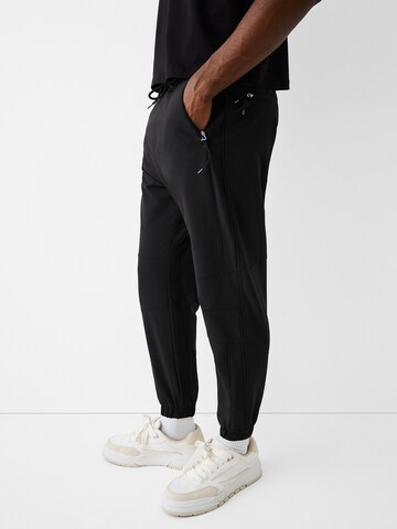 Bershka Tapered Pants in Black