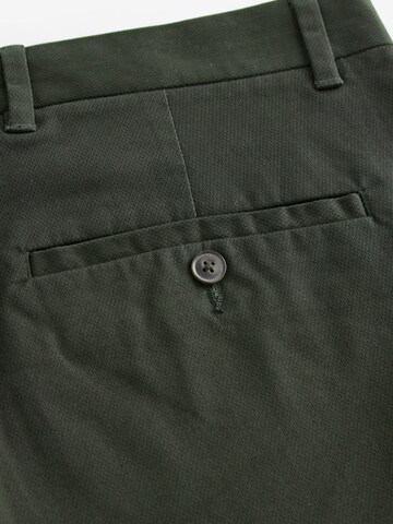 Slimfit Pantaloni chino di Next in verde