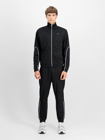 ALPHA INDUSTRIES - Tapered Pantalón 'Essential' en negro