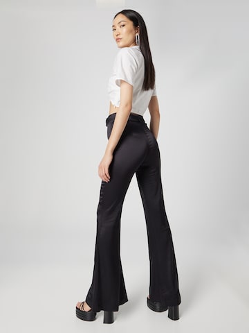 Katy Perry exclusive for ABOUT YOU Flared Trousers 'Nancy' in Black