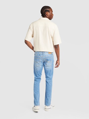 GUESS Tapered Jeans i blå