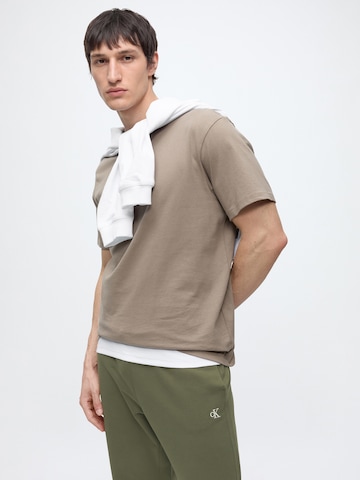 Calvin Klein Jeans Tapered Hose in Grün