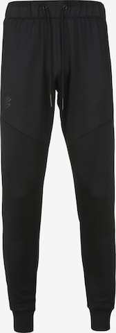 Effilé Pantalon de sport UNDER ARMOUR en noir : devant