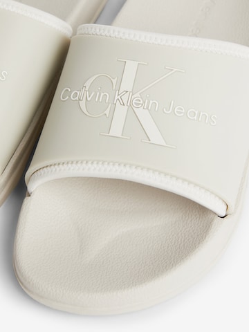 Calvin Klein Jeans Mules in Beige