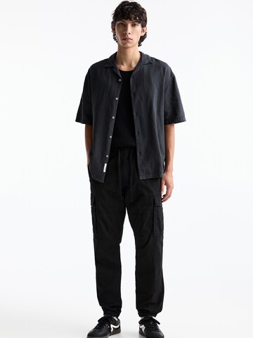 Loosefit Pantaloni cargo di Pull&Bear in nero