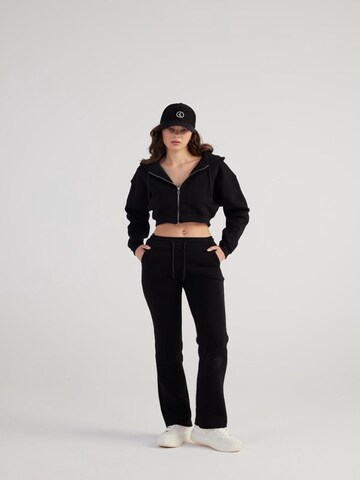 HOLLY LOLLY Regular Trousers in Black: front