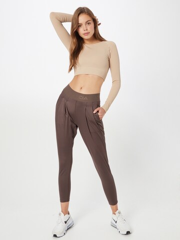 Athlecia Tapered Workout Pants 'Beastown' in Brown