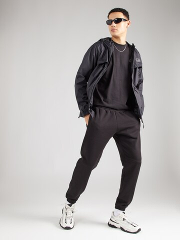 Tapered Pantaloni 'Naisi' de la ELLESSE pe negru