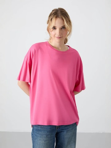 T-shirt 'T-Shirts' Tommy Life en rose : devant