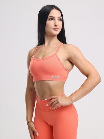neverover Korzetová Sportovní podprsenka 'Hue Cross-Back Strappy Bra' – oranžová