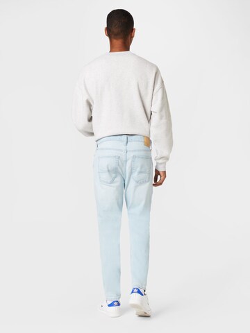 HOLLISTER Tapered Jeans in Blau