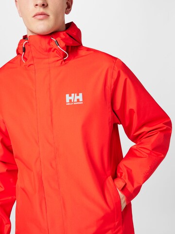 HELLY HANSEN Ulkoilutakki 'SEVEN J' värissä punainen