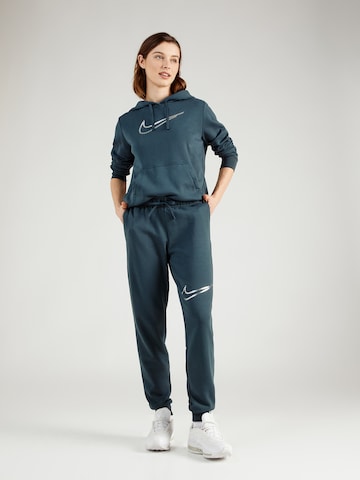 žalia Nike Sportswear Siaurėjantis Kelnės 'Club Fleece'