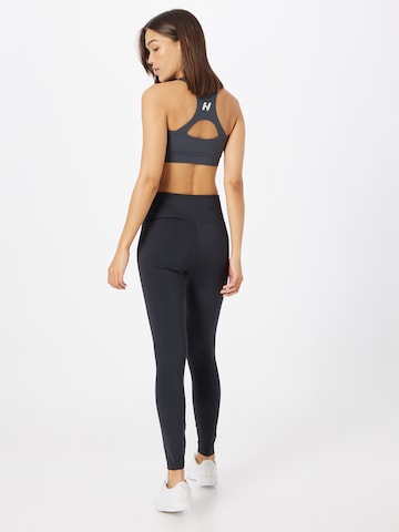 Skinny Pantaloni sport 'Court' de la Röhnisch pe negru