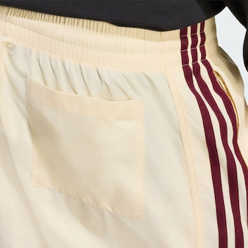 ADIDAS ORIGINALS - Regular Calças 'Sprinter' em amarelo
