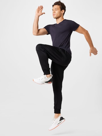 CURARE Yogawear Funkční tričko 'Flow' – modrá
