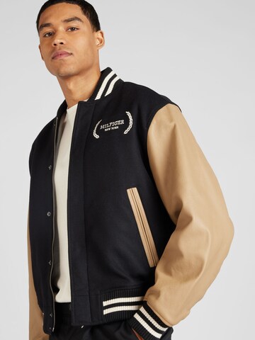 TOMMY HILFIGER Between-Season Jacket 'VARSITY' in Black