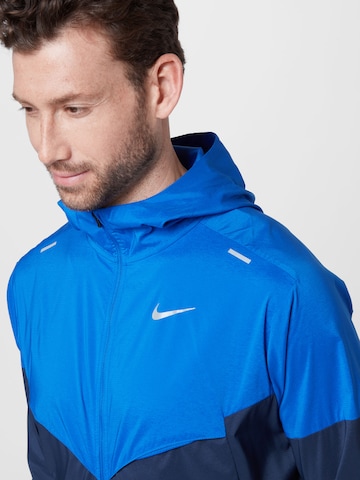 Veste de sport NIKE en bleu