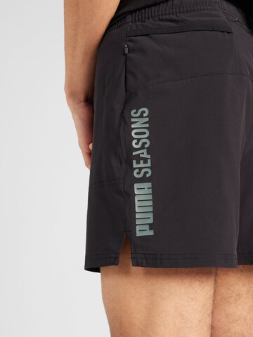 Regular Pantalon de sport 'Seasons' PUMA en noir