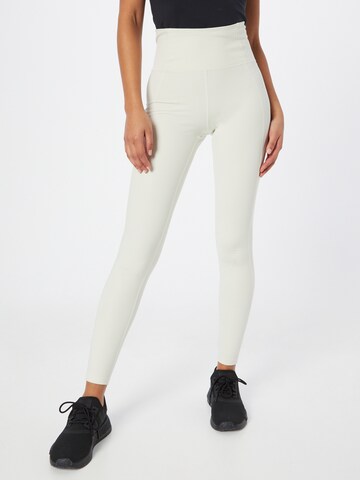 Girlfriend Collective Slimfit Sportbroek in Beige: voorkant