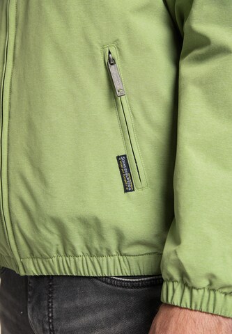Schmuddelwedda Toiminnallinen takki värissä vihreä