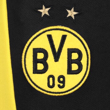 melns PUMA Pakapēniski sašaurināts piegriezums Sporta bikses 'Borussia Dortmund'