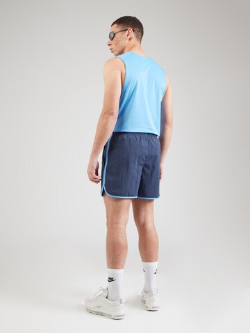 NIKE Regular Sports trousers 'HERITAGE' in Blue