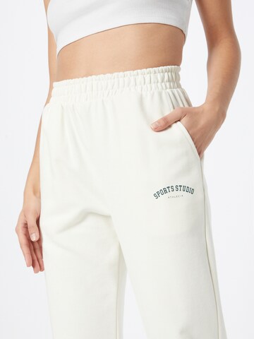 Effilé Pantalon de sport Athlecia en blanc