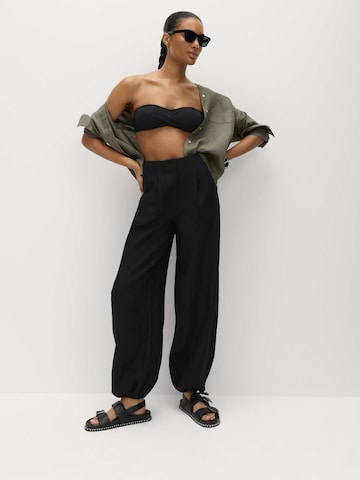 Baggy Pantaloni di Marks & Spencer in nero: frontale