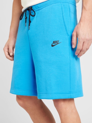 Nike Sportswear Voľný strih Nohavice - Modrá