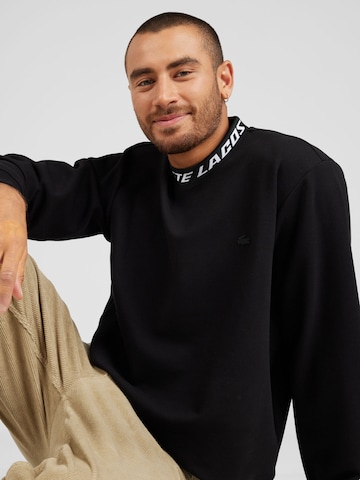 LACOSTE Sweatshirt i svart
