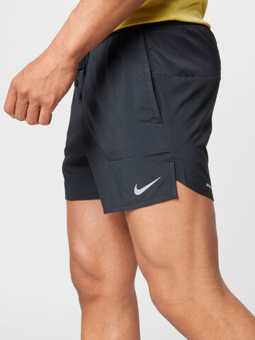 NIKE Regular Sports trousers 'Flex Stride' in Black