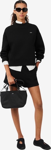 LACOSTE Kabelka 'Lacoste Femme Petit sac à main L Day in Noir' – černá