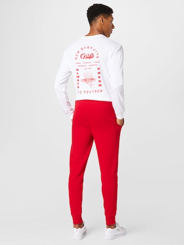 GAP - Tapered Calças em vermelho